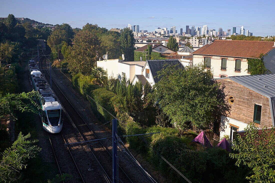 France, Hauts de Seine, Saint Cloud, Tramway T2 (Pont de Bezons/Porte de Versailles line) and La Defense from the Avre footbridge