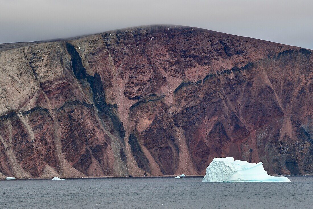 Greenland, West Coast, North Star Bay off the mouth of Wolstenholme Fjord, red sandstone cliffs