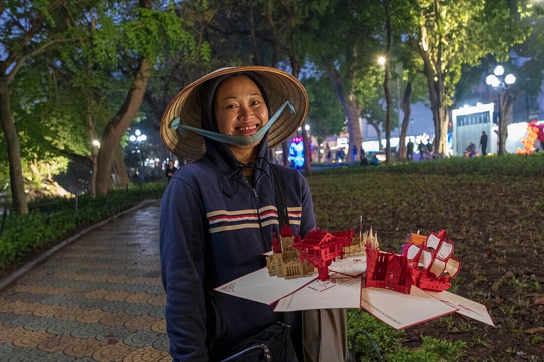 Vietnam, Red River Delta, Hanoi, street vendor of postcards