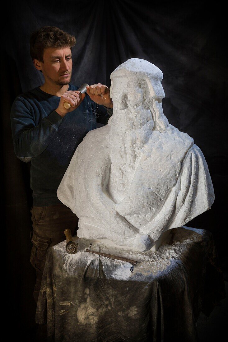 France, Indre et Loire, Chemille sur deme, the sculptor Ianek Kocher sculpting the bust of Leonardo da Vinci in Carrara marble in his workshop for the 500 years of the death of Leonardo da Vinci at the castle of Amboise