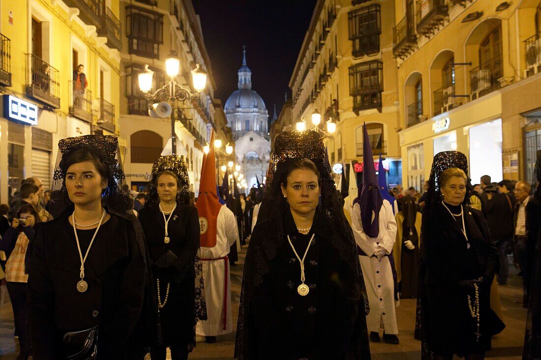 Spain, Aragon Region, Zaragoza Province, Zaragoza, Semana Santa (Holy Week) celebrations, Basilica de Nuestra Senora de Pilar in the background