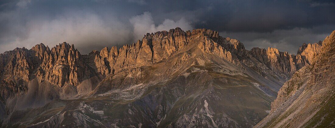 France, Savoie, Valloire, massif des Cerces, cycling ascension of the Col du Galibier, one of the routes of the largest bike path in the world, seen from the sunset over the rocks of the great Pare (2720m)