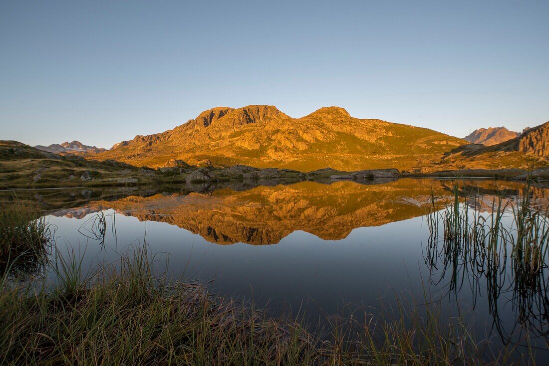 France, Savoie, Saint Jean de Maurienne, Saint Sorlin d'Arves, At the cross of the Iron Cross, sunrise on Lake Guichard located a few hundred meters from the pass