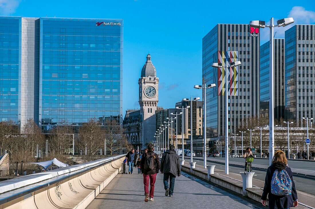 France, Paris, Pont Charles de Gaulle by architects Louis Gerald Arretche and Roman Karansinski and business district of Gare de Lyon, Tour de l'Horloge (Clock Tower) in the background