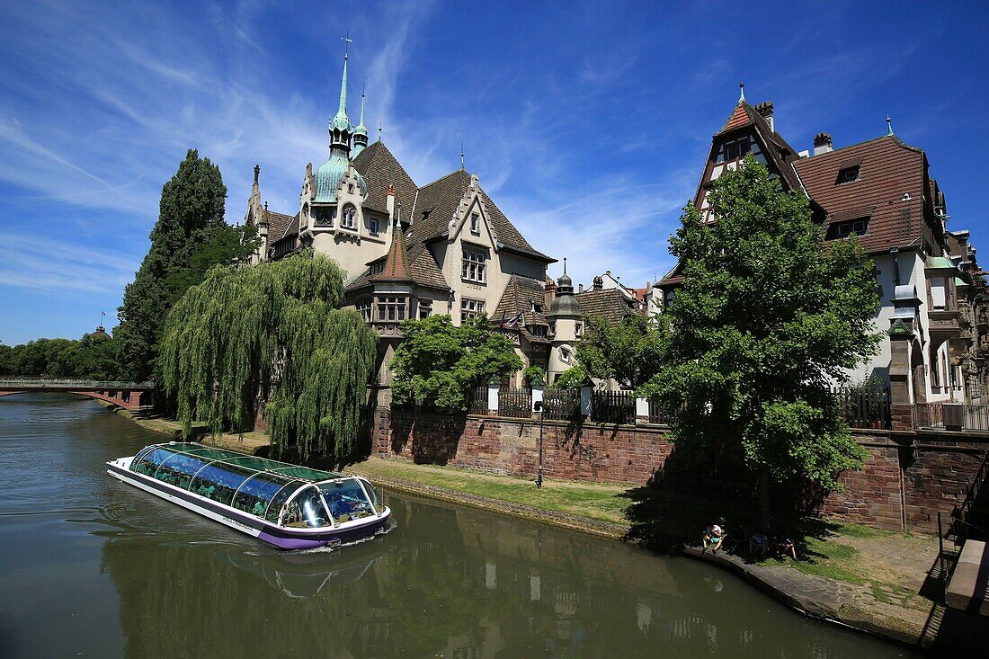 France, Bas Rhin, Strasbourg, district of Neustadt dating from the German period listed as a UNESCO World Heritage Site, the Faux Remparts canal and the Pontonniers high school at 1, rue des Pontonniers