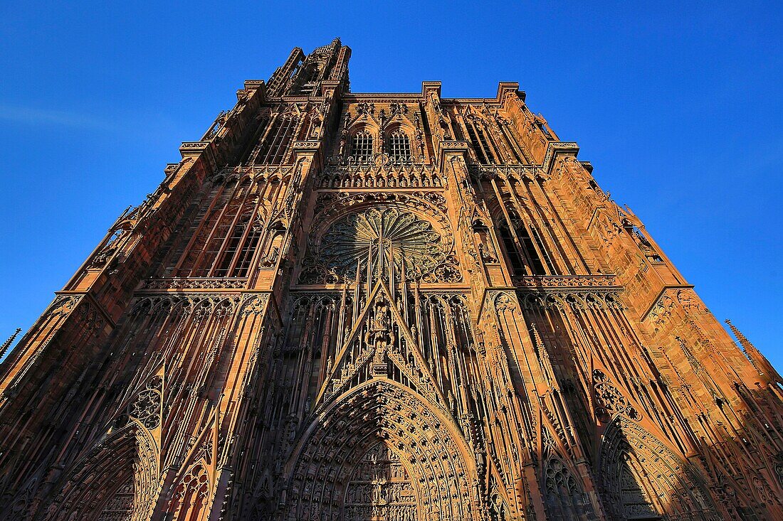 France, Bas Rhin, Strasbourg, The facade of Notre Dame Cathedral at sunset