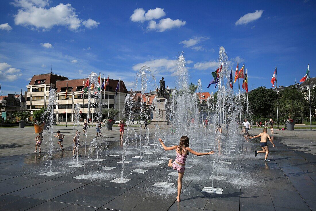 France, Haut Rhin, Colmar, children playing in the fountains of Place Rapp in Colmar