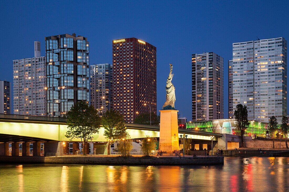 France, Paris, the banks of the Seine, the buildings of the Beaugrenelle district, the island of the swans with the Statue of Liberty