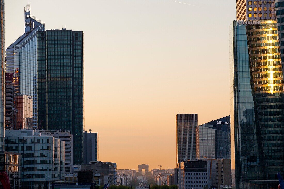 France, Hauts de Seine, La Defense, the buildings of the business district, the Arc de Triomphe in the background