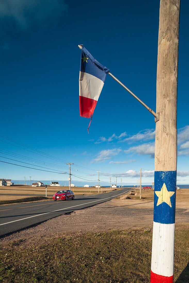 Canada, New Brunswick, Acadian Peninsula, Miscou Island, Pigeon Hill, country road with Acadian symbols