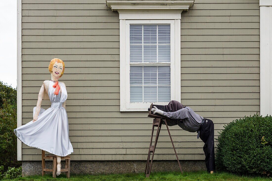 Canada, Nova Scotia, Mahone Bay, Scarecrow Festival, scarecrows in the likeness of a photographer and model