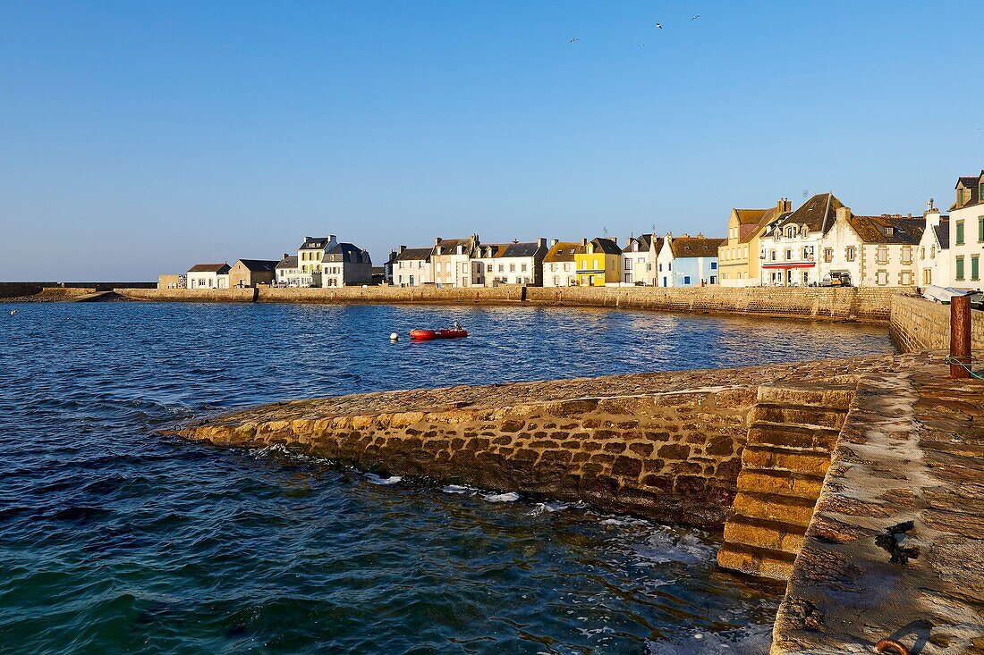 France, Finistere, Iroise Sea, Iles du Ponant, Parc Naturel Regional d'Armorique (Armorica Regional Natural Park), Ile de Sein, labelled Les Plus Beaux de France (The Most Beautiful Village of France), the harbour high tide and the houses on the quay des français libres