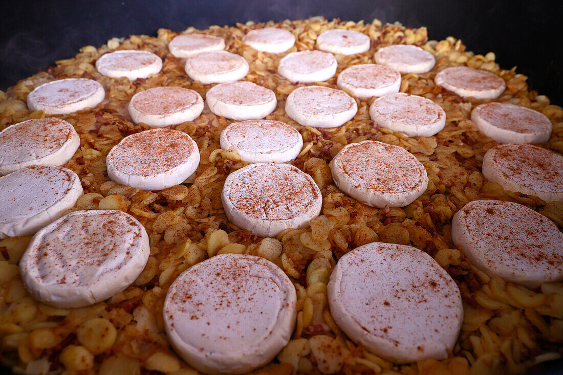 Giant fresh tartiflette, made with Roblochon cheese, potatoes and ham, a speciality in the French Alpes, Saint Gervais, Haute-Savoie, France, Europe