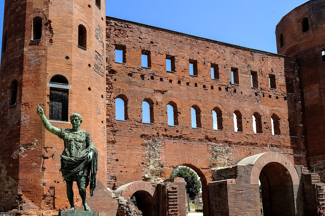 Statue of Julius Caesar located at the Palatine Gate, a Roman-era city gate, the Porta Principalis Dextra of the ancient town giving entry through the Julia Augusta Taurinorum walls from the North side, Turin, Piedmont, Italy, Europe