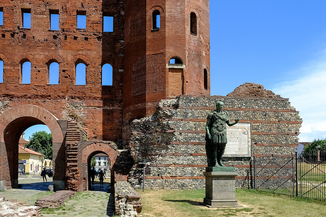 Statue of Julius Caesar located at the Palatine Gate, a Roman-era city gate, the Porta Principalis Dextra of the ancient town giving entry through the Julia Augusta Taurinorum walls from the North side, Turin, Piedmont, Italy, Europe