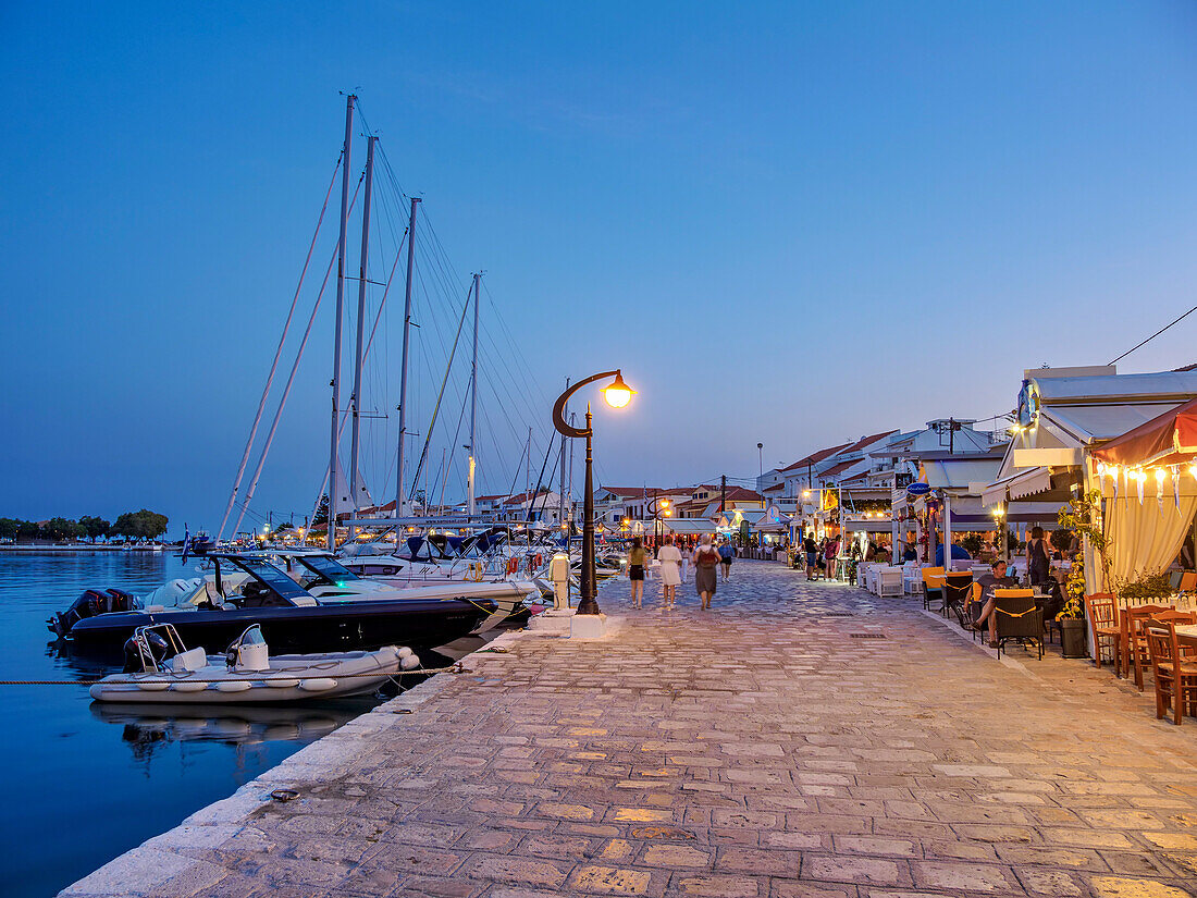 Restaurants at the waterfront at dusk, Port of Pythagoreio, Samos Island, North Aegean, Greek Islands, Greece, Europe