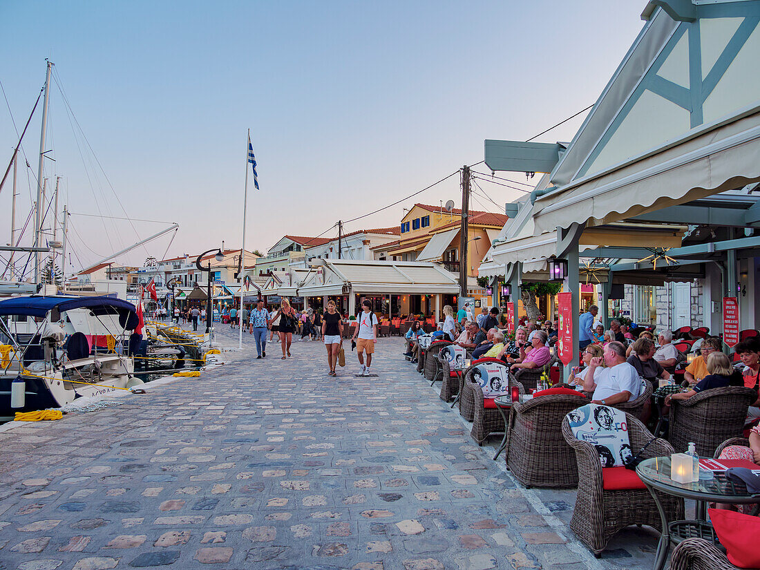 Restaurants at the waterfront at dusk, Port of Pythagoreio, Samos Island, North Aegean, Greek Islands, Greece, Europe