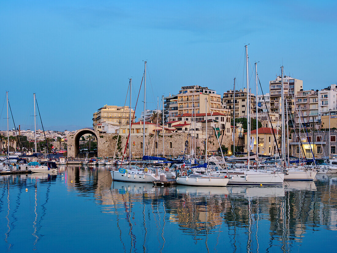 Venetian Dockyards at the Old Port at dusk, City of Heraklion, Crete, Greek Islands, Greece, Europe