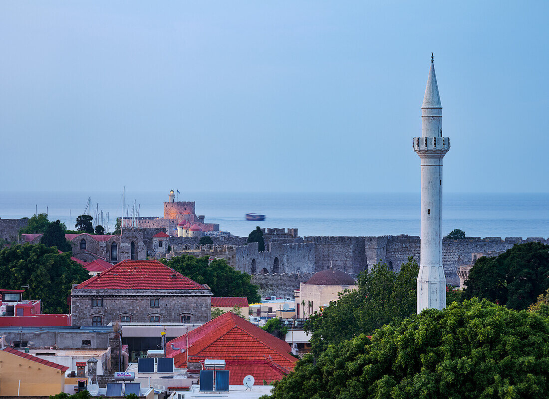 View over Ibrahim Pasha Mosque Minaret and Medieval Old Town towards Saint Nicholas Fortress at dusk, Rhodes City, Rhodes Island, Dodecanese, Greek Islands, Greece, Europe