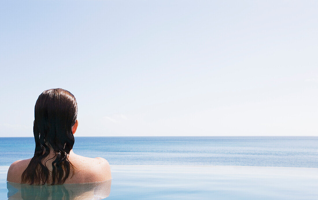 Woman in swimming pool, US Virgin Islands, USA