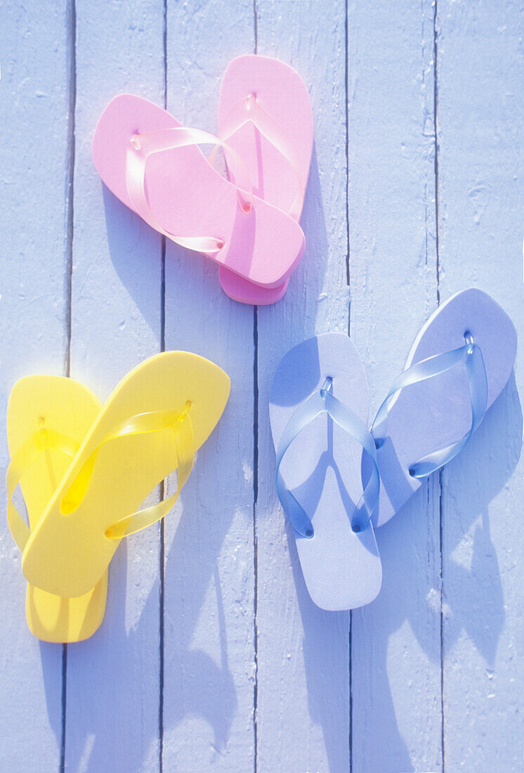 USA, Virgin Islands, St. John, Overhead view of colorful flip flops on deck