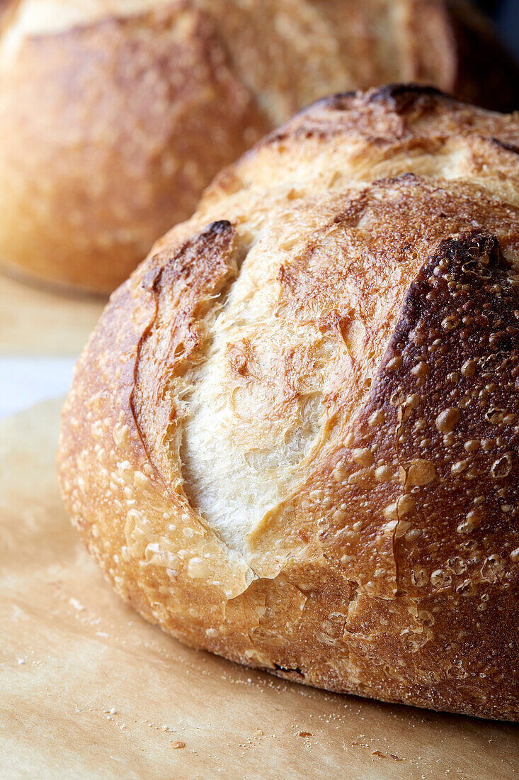 Close-up of sourdough bread on parchment paper