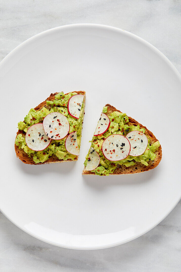 Overhead view of avocado toast on plate