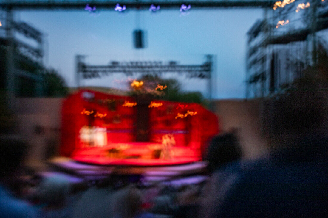 Blurred motion of stage at outdoor theater at dusk