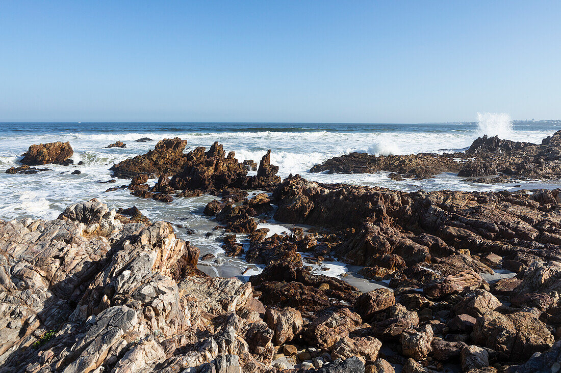 South Africa, Hermanus, Rocky coastline and sea at Kammabaai Beach