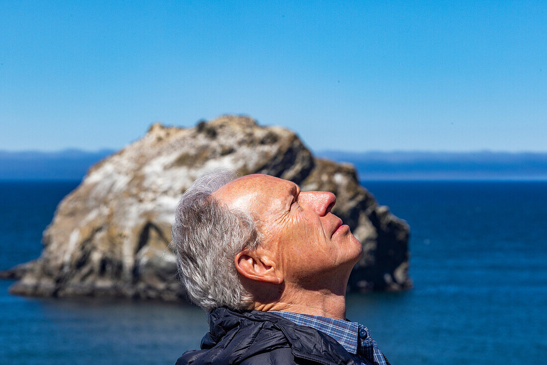 Side view of senior man looking up