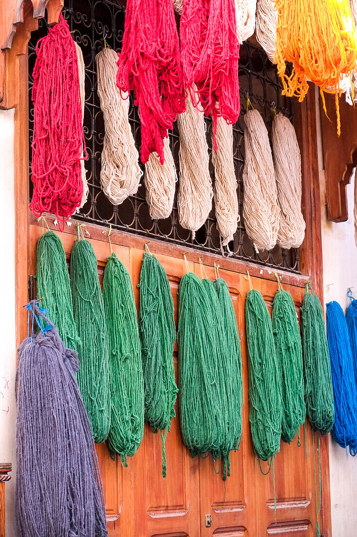 Fes, Morocco. Skeins of yarn hang to dry after being hand dyed