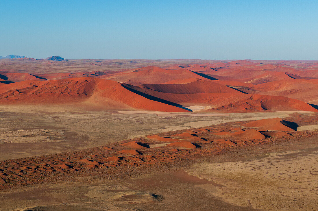 An aerial view of red sand dunes in the Namib desert. Namib Naukluft Park, Namibia.