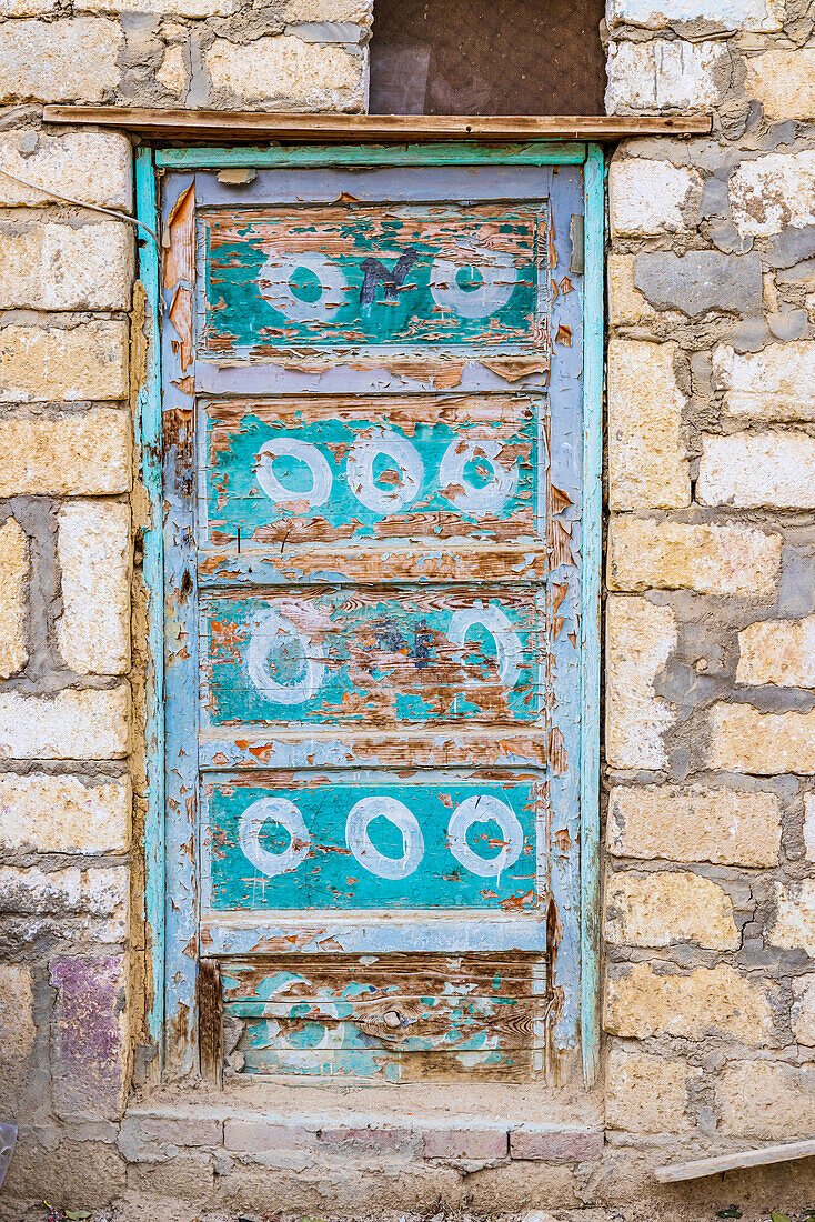 Faiyum, Egypt. A blue painted door on a building.