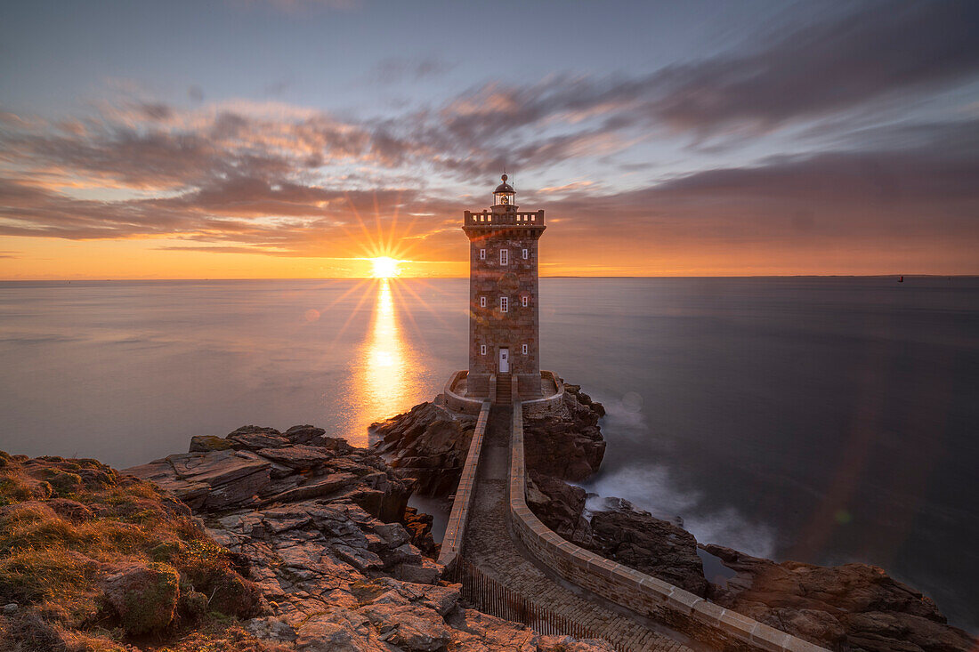 France, Brittany, Le Conquet. Sun setting at the Kermorvan Lighthouse