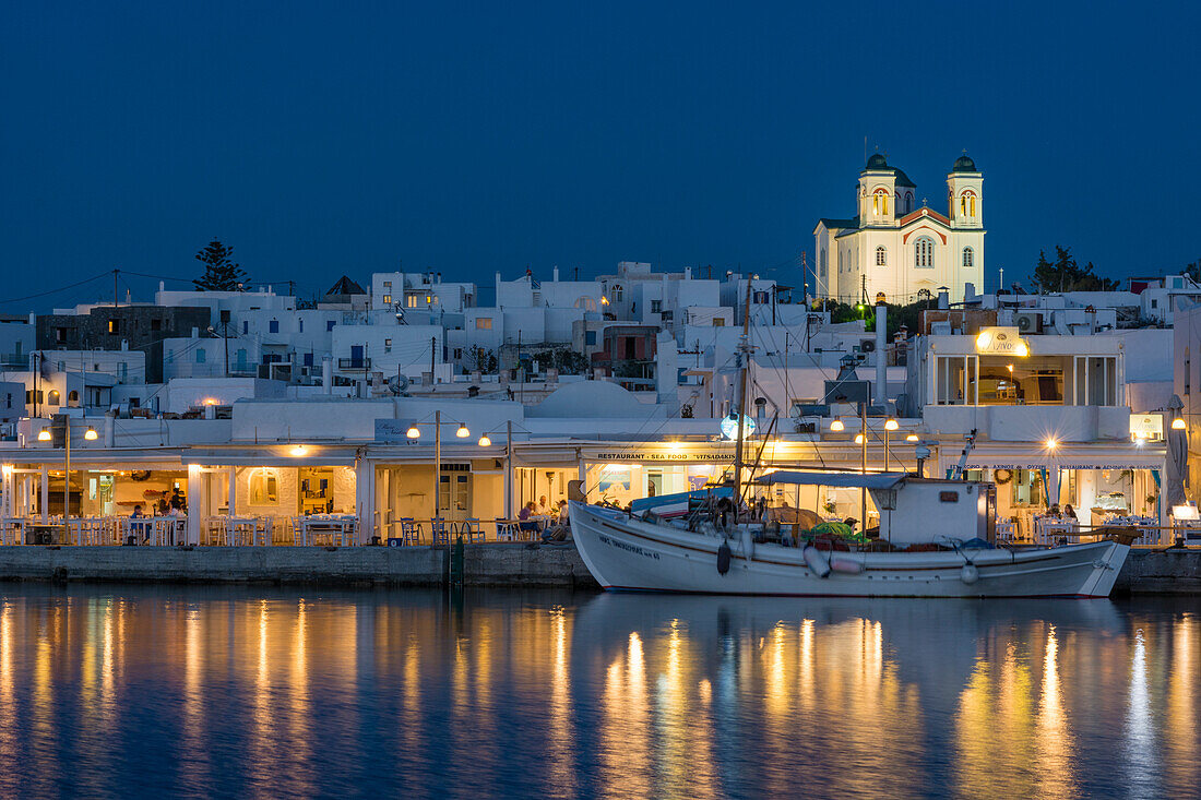 A view of the village of Naousa and dock at night. Naousa, Paros Island, Cyclades Islands, Greece.