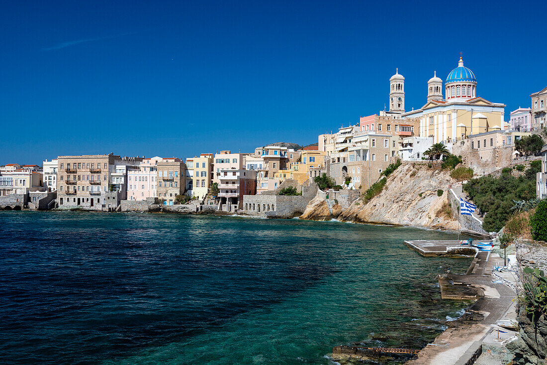 Agios Nikolaos Church, and houses long the shore in Ermoupoli, Siros Island, Cyclades Islands, Greece.