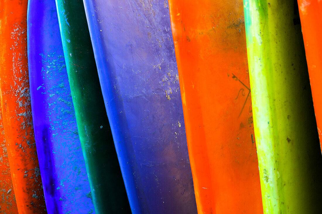 Stacked surf boards at sunset after a day of surf school in Canggu, Bali, Indonesia