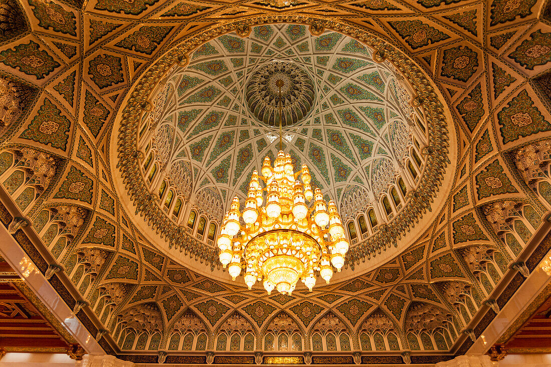 An ornate ceiling in the men's prayer room of the Sultan Qaboos Grand Mosque, Muscat, Oman.