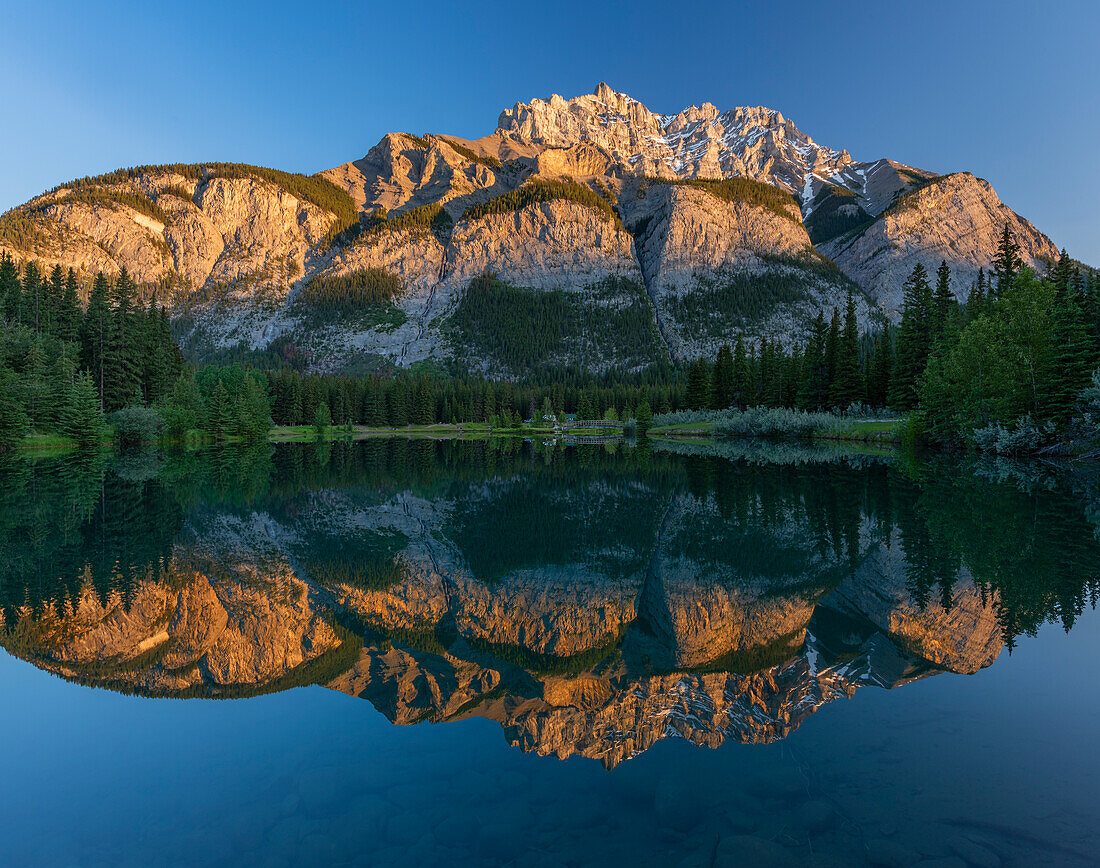 Canada, Alberta, Banff National Park. Cascade Mountain reflected in Cascade Pond at sunrise.