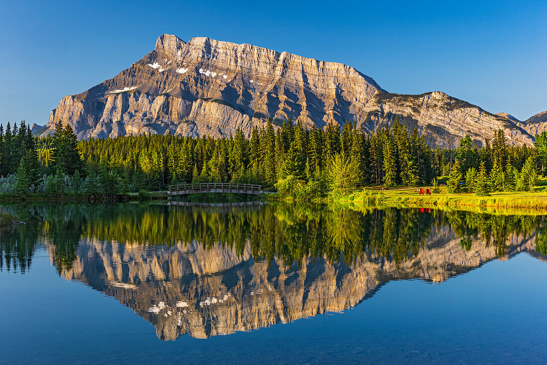 Canada, Alberta, Banff National Park. Mt. Rundle reflected in Two Jack Lake at sunrise.