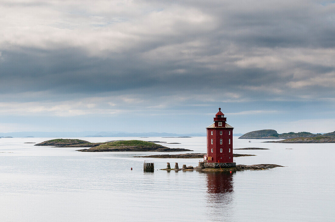 The 1880 Kjeungskjaer lighthouse sits on a small island in the glacial waters of Bjugnfjorden. Bjugnfjorden, Norway.