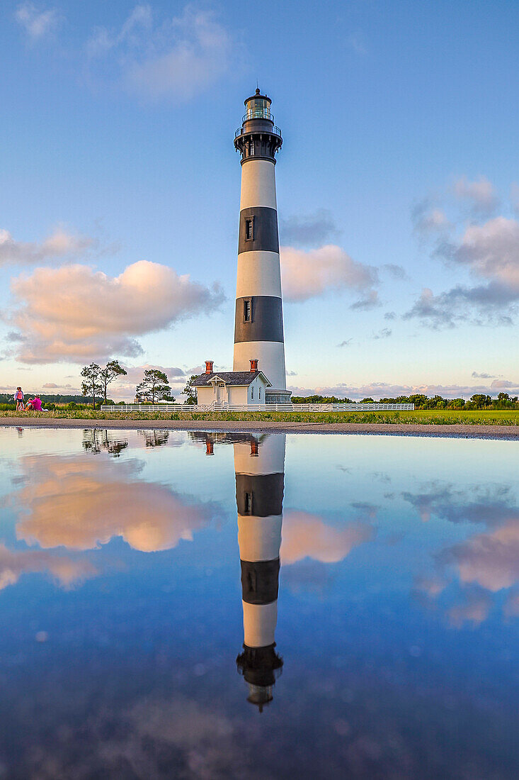 USA, North Carolina, Nags Head. Bodie Island Lighthouse reflection in a puddle