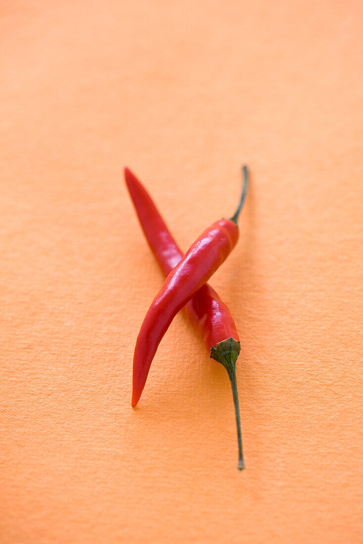 Two red chilli peppers