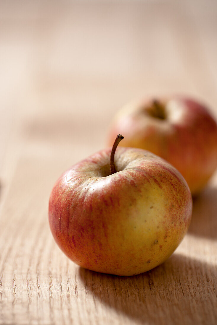 Single apple on wooden table