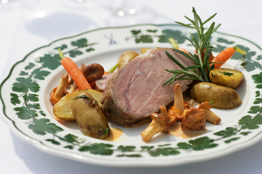 Saddle of veal with potatoes and vegetables