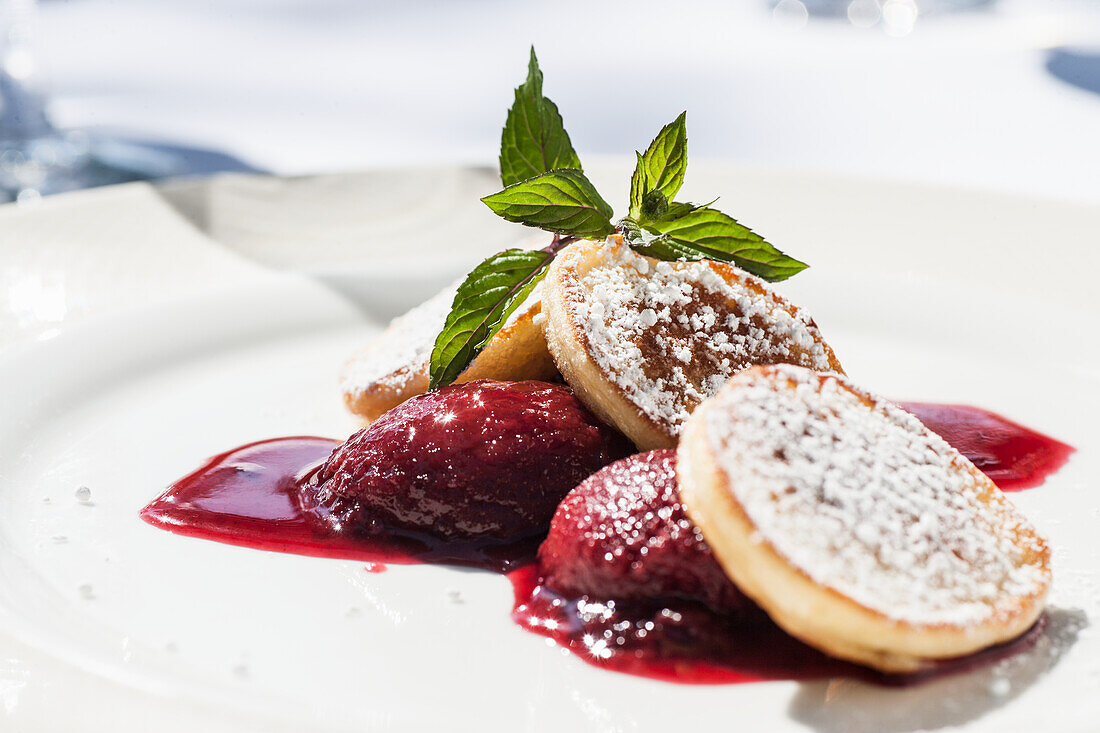 Pancakes with stewed plums