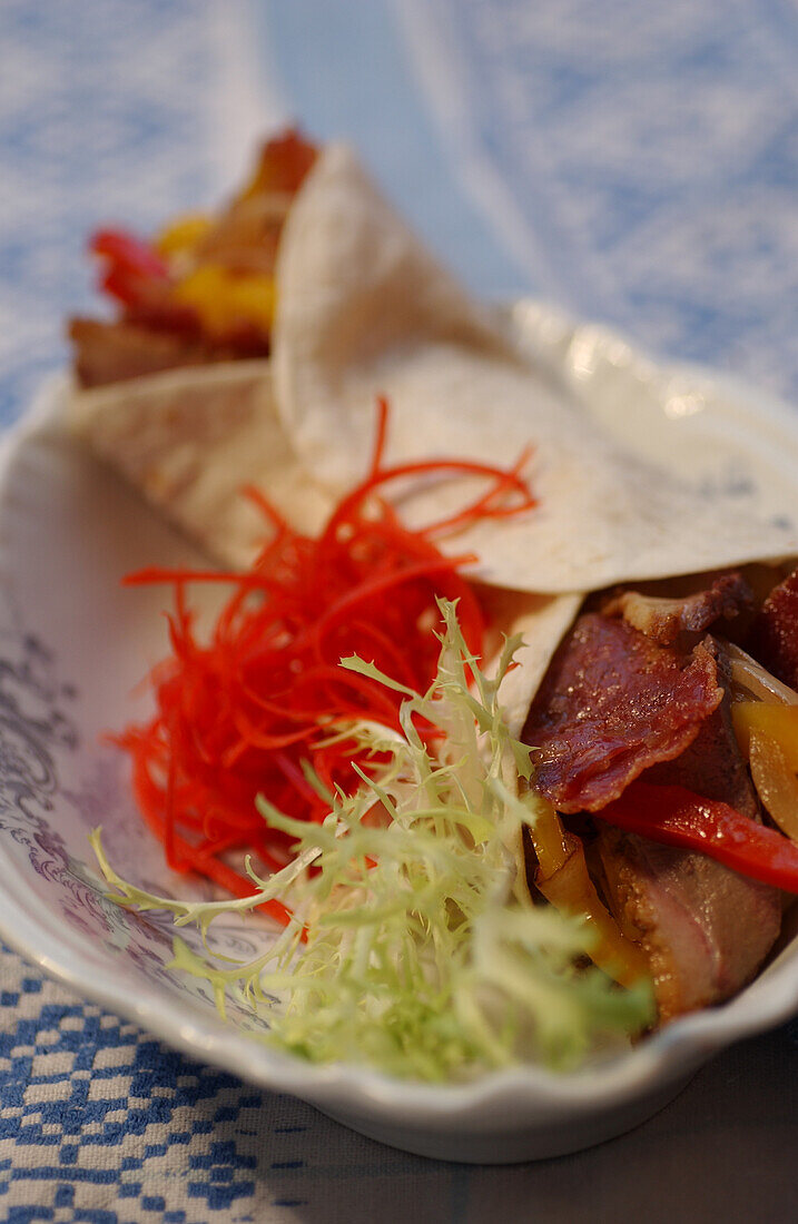 Duck tacos with vegetables and frisée salad
