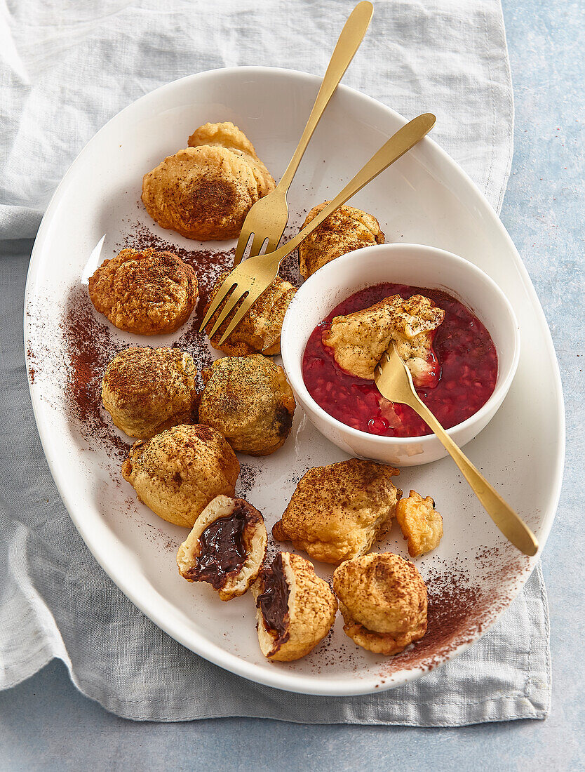 Baked chilli chocolate truffles with raspberry sauce