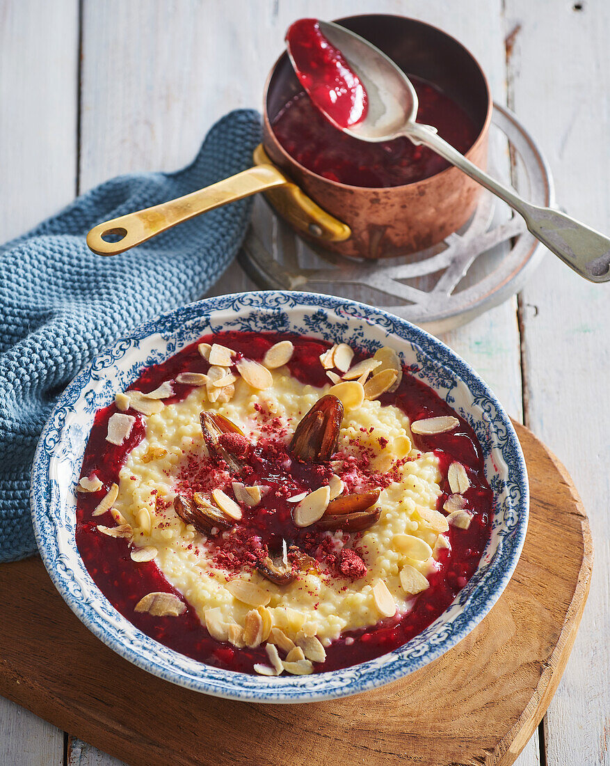 Coconut and millet porridge with raspberries, dates and almonds