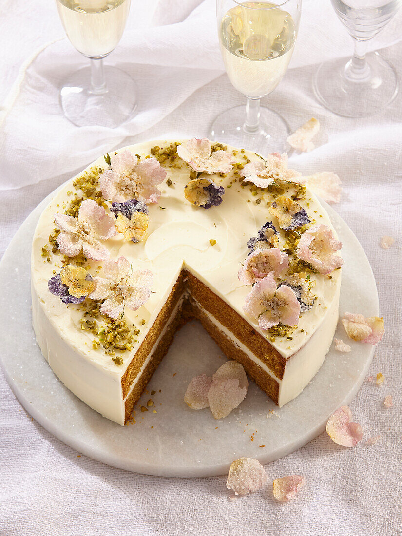 Carrot cake with mascarpone and candied flowers